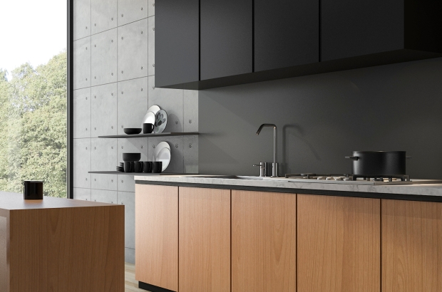 Modern kitchen with light oak lower cabinets and dark upper units, lit by daylight from a side window